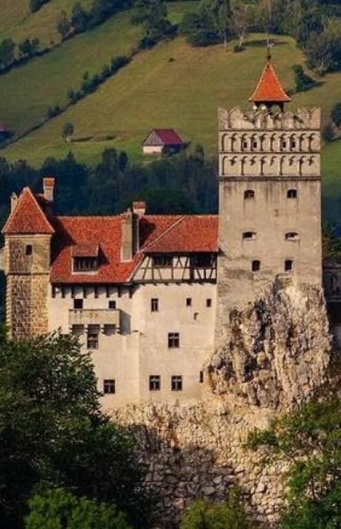 Bran Castle — Dracula's Castle — perched on its rock above the forest